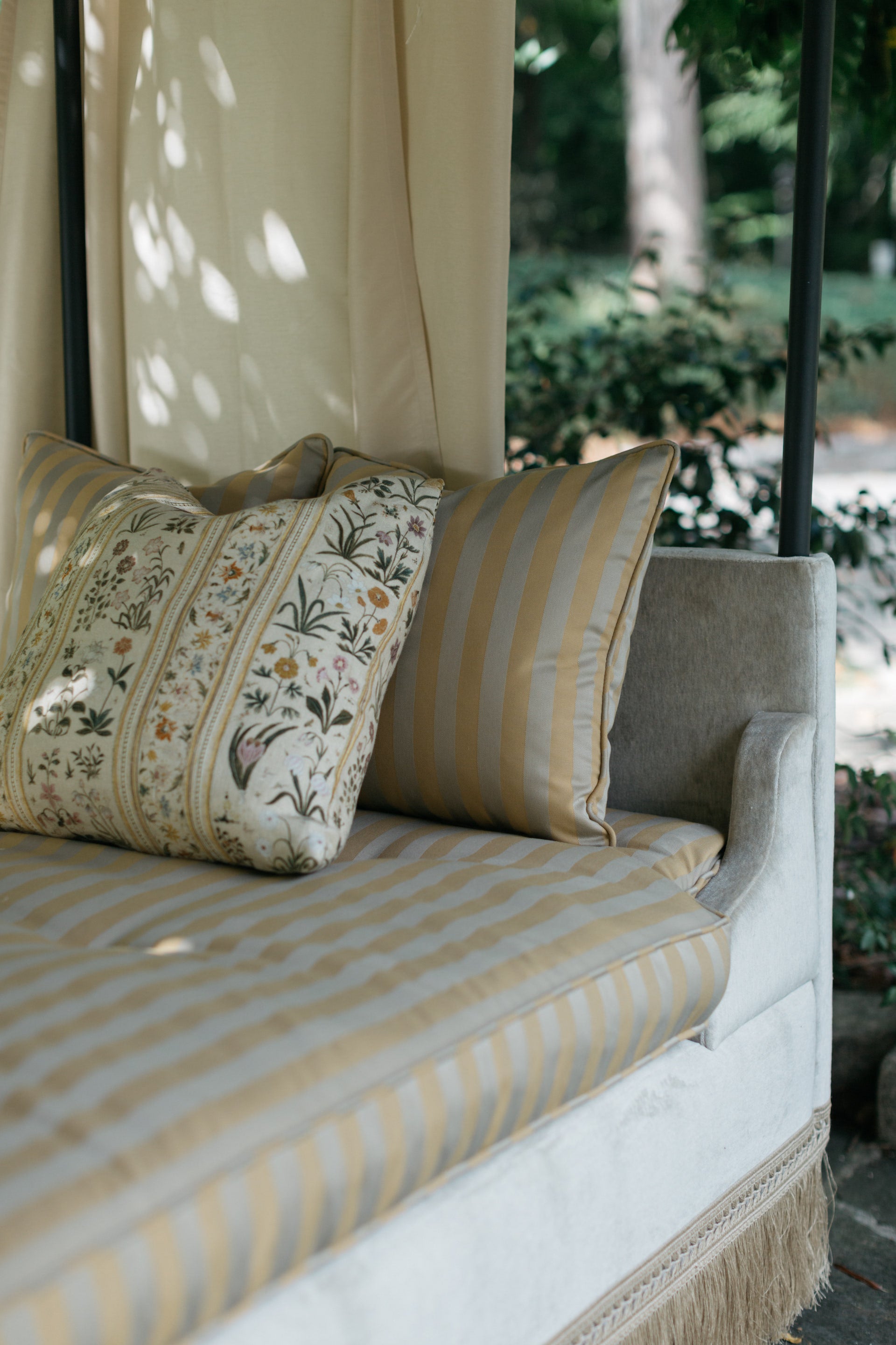 Botanico 22x22 pillow styled on Serenbe Daybed in outdoor setting – Page House Studio